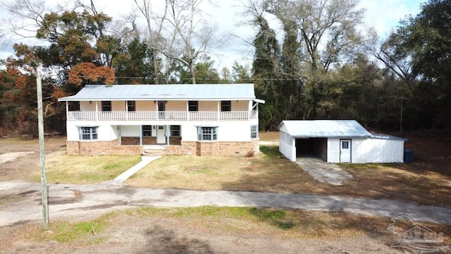 view of front of house with an outbuilding