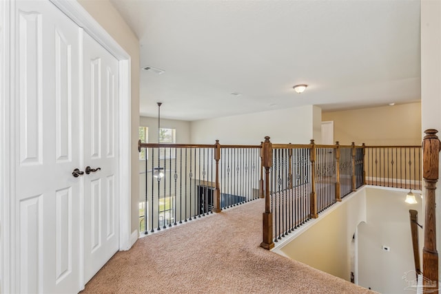 corridor with visible vents and carpet