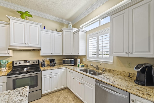 kitchen with under cabinet range hood, stainless steel appliances, a sink, white cabinets, and ornamental molding