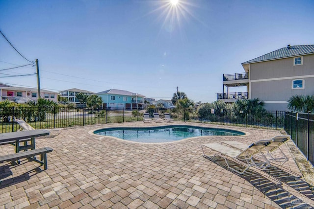 pool featuring a patio and fence