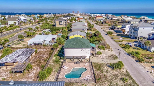 birds eye view of property with a water view and a residential view