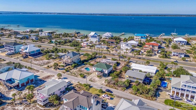 aerial view featuring a residential view and a water view