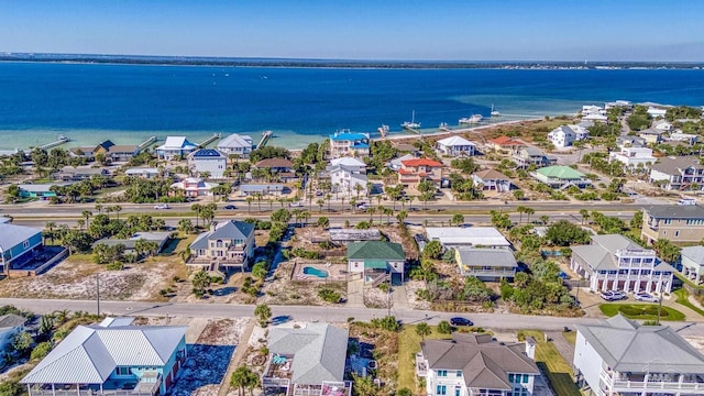 aerial view featuring a residential view and a water view