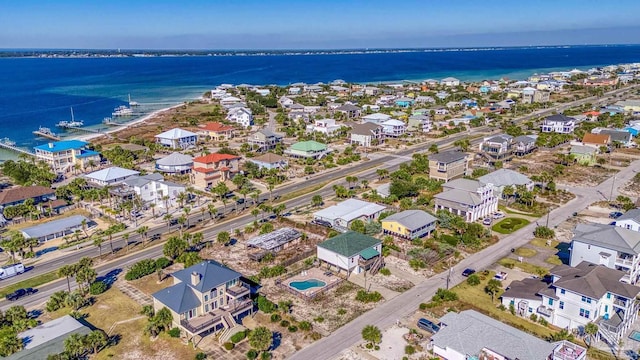 aerial view featuring a residential view and a water view