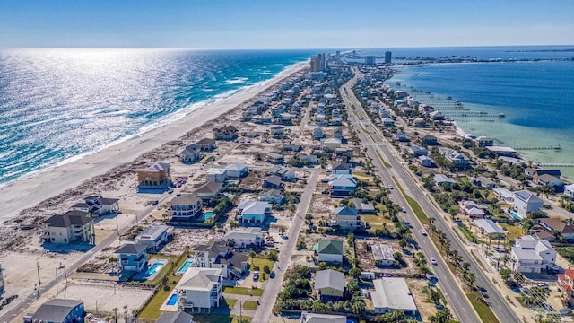 birds eye view of property featuring a water view and a view of the beach