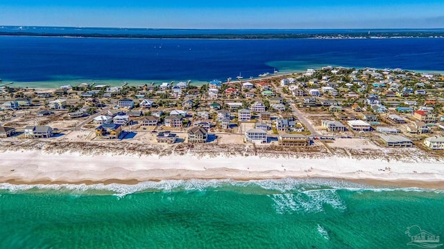 aerial view with a water view, a residential view, and a view of the beach