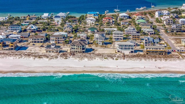 aerial view featuring a beach view, a residential view, and a water view