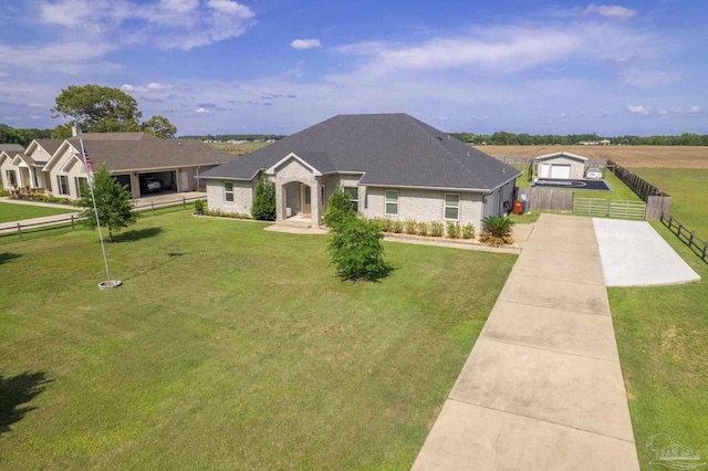 9074 Byrom Campbell Rd, Pace, FL 32571 - view of front of house with brick siding, a shingled roof, and concrete driveway