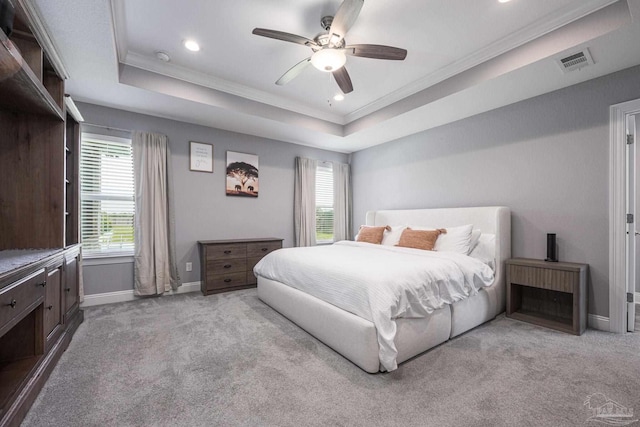 9074 Byrom Campbell Rd, Pace, FL 32571 - bedroom featuring crown molding, carpet floors, a tray ceiling, baseboards, and recessed lighting