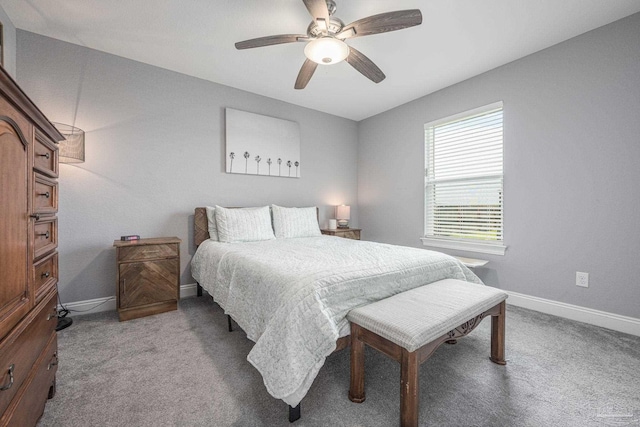 9074 Byrom Campbell Rd, Pace, FL 32571 - bedroom with light colored carpet, baseboards, and a ceiling fan
