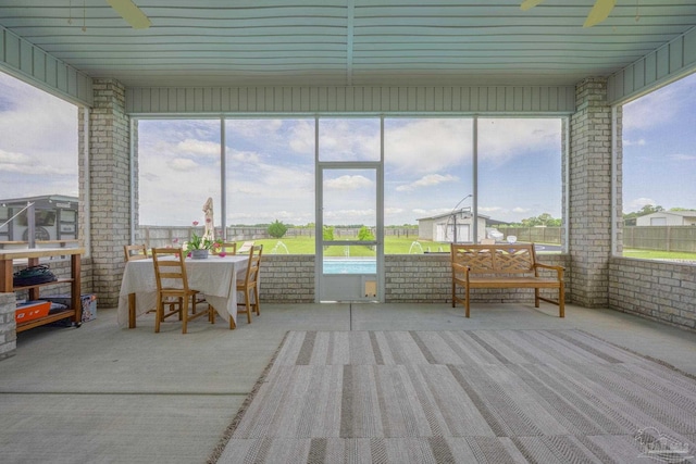 9074 Byrom Campbell Rd, Pace, FL 32571 - sunroom featuring a ceiling fan and outdoor dining space