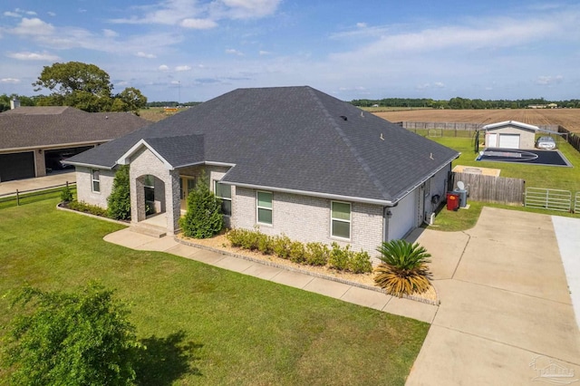 9074 Byrom Campbell Rd, Pace, FL 32571 - view of front of home featuring brick siding, driveway, a shingled roof, and an attached garage