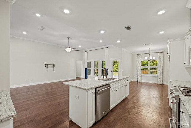 kitchen with appliances with stainless steel finishes, a kitchen island with sink, a sink, and visible vents