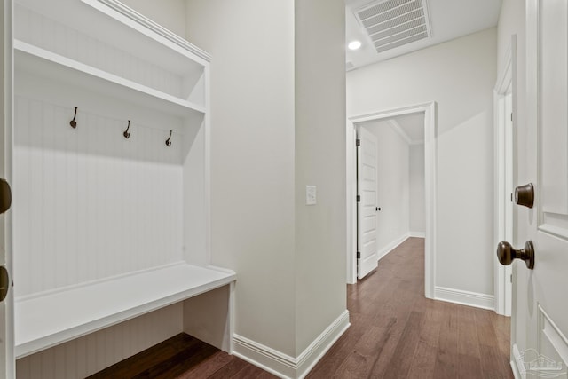 mudroom with visible vents, baseboards, and dark wood-style flooring
