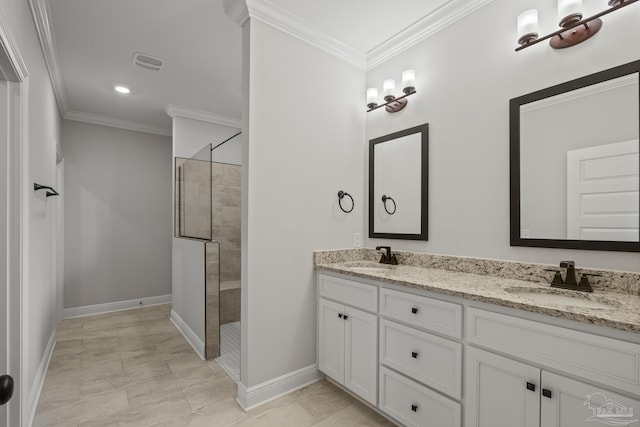 bathroom with visible vents, a sink, ornamental molding, and tiled shower