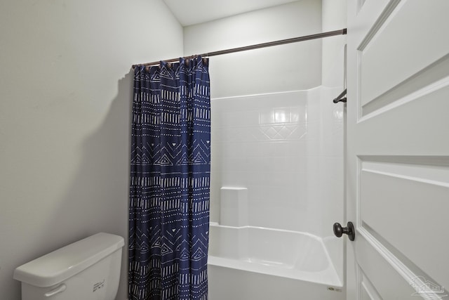 full bath with shower / bath combo with shower curtain and toilet
