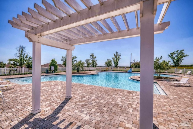 pool featuring fence, a patio, and a pergola