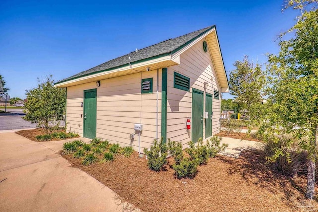 view of property exterior featuring an outbuilding