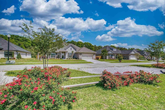 view of front of property featuring concrete driveway and a front yard