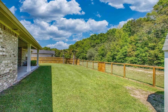 view of yard featuring a fenced backyard