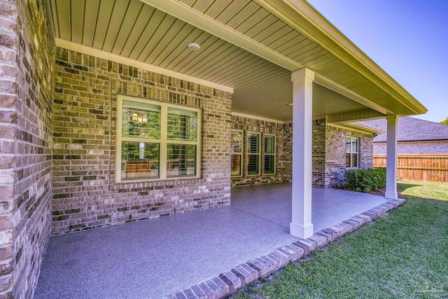 view of patio / terrace featuring fence