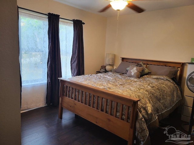 bedroom with ceiling fan and hardwood / wood-style floors