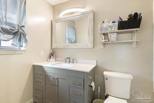 bathroom featuring vanity and toilet