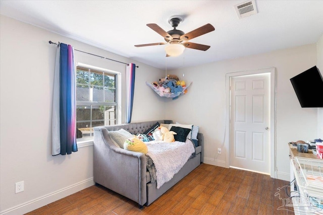 bedroom featuring ceiling fan and dark hardwood / wood-style floors