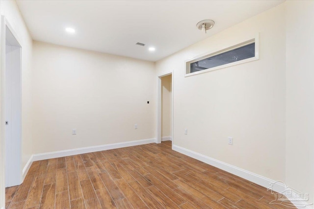 basement with wood-type flooring