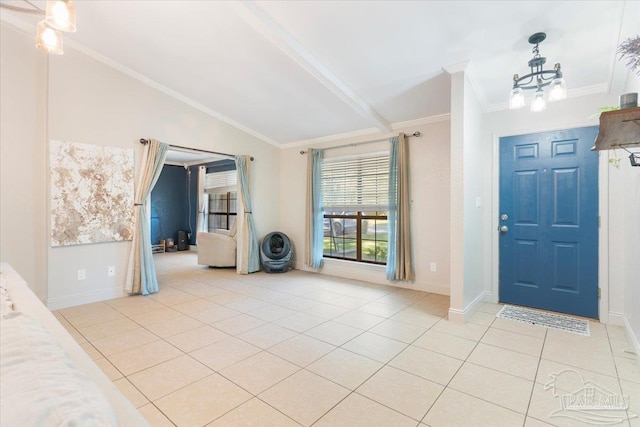 tiled entrance foyer featuring lofted ceiling with beams, ornamental molding, and a notable chandelier