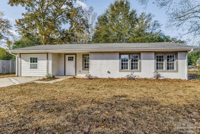 ranch-style home with a front yard