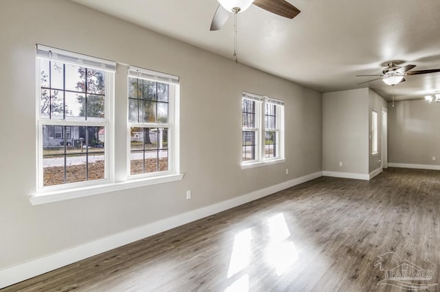 spare room featuring hardwood / wood-style floors, plenty of natural light, and ceiling fan