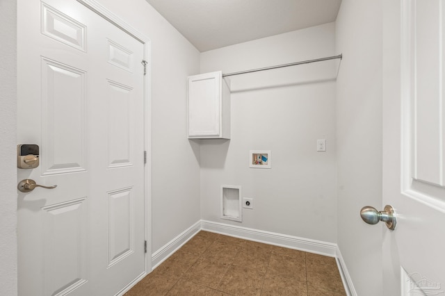 5649 Cane Syrup Cir, Pace, FL 32571 - washroom featuring washer hookup, dark tile patterned floors, hookup for an electric dryer, cabinet space, and baseboards