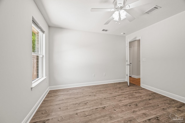 5649 Cane Syrup Cir, Pace, FL 32571 - empty room featuring a ceiling fan, baseboards, visible vents, and wood finished floors