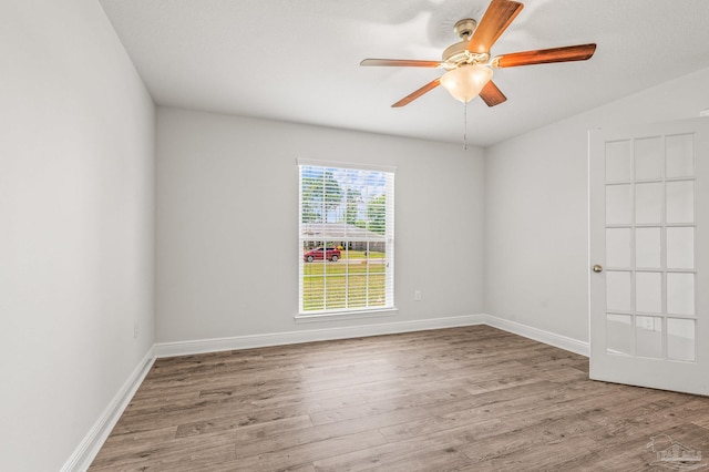 5649 Cane Syrup Cir, Pace, FL 32571 - unfurnished room featuring a ceiling fan, baseboards, and wood finished floors