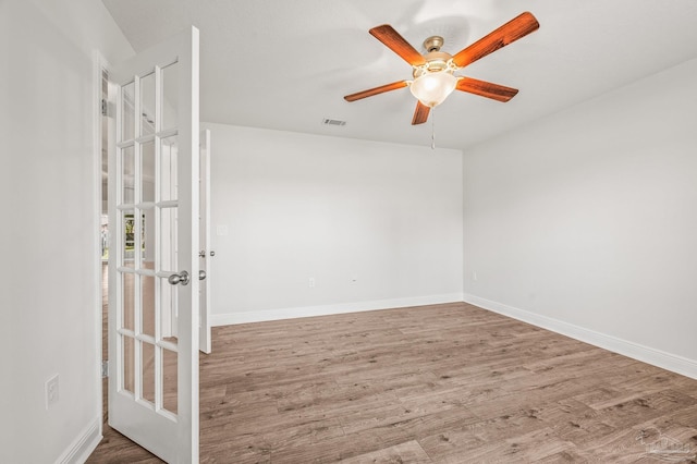 5649 Cane Syrup Cir, Pace, FL 32571 - spare room with baseboards, ceiling fan, visible vents, and wood finished floors