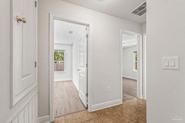 5649 Cane Syrup Cir, Pace, FL 32571 - hall with baseboards, visible vents, and tile patterned floors