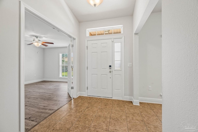 5649 Cane Syrup Cir, Pace, FL 32571 - entryway with baseboards, ceiling fan, and tile patterned floors