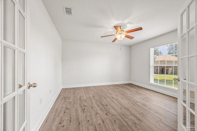 5649 Cane Syrup Cir, Pace, FL 32571 - spare room featuring ceiling fan, visible vents, baseboards, and light wood finished floors