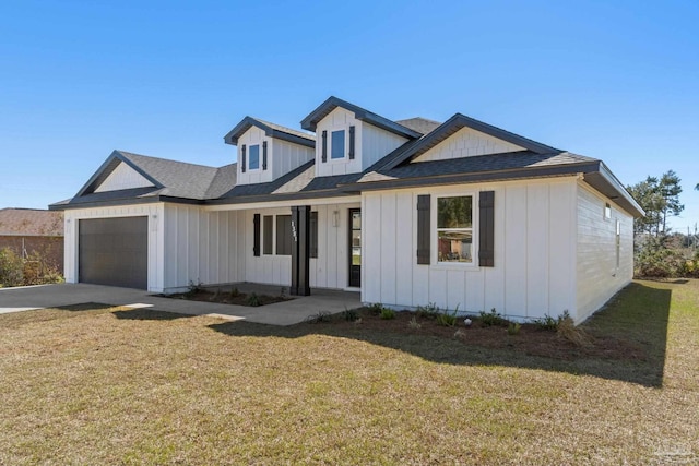 view of front of home featuring a garage and a front lawn