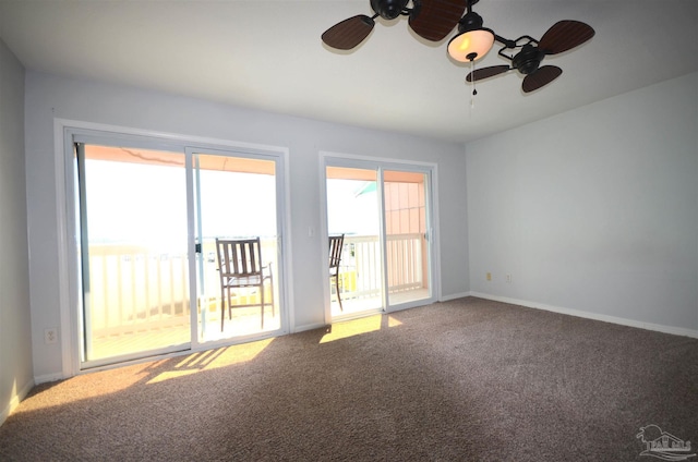 unfurnished room featuring carpet, baseboards, and ceiling fan