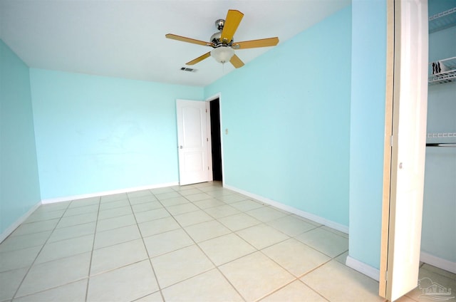 unfurnished bedroom featuring a closet, visible vents, baseboards, and light tile patterned flooring
