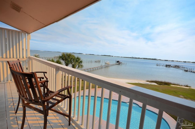 balcony featuring a water view