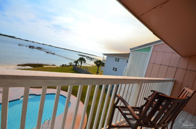 balcony featuring a water view