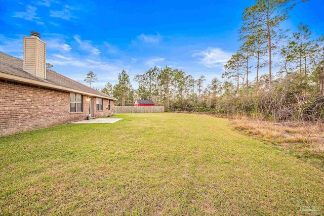 view of yard featuring a patio area and fence