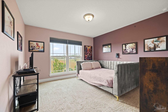 carpeted bedroom featuring a textured ceiling