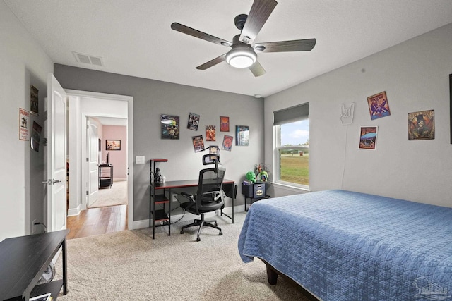 carpeted bedroom with ceiling fan