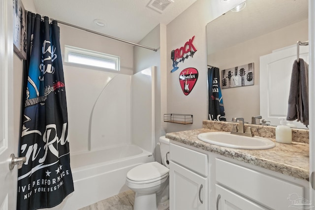 full bathroom featuring shower / bath combo, toilet, and vanity