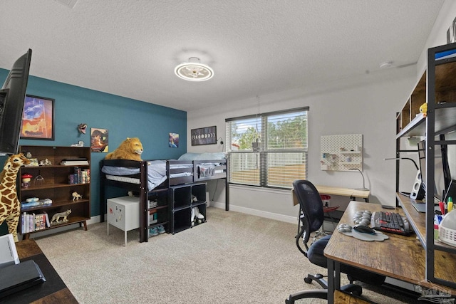 bedroom with light carpet and a textured ceiling