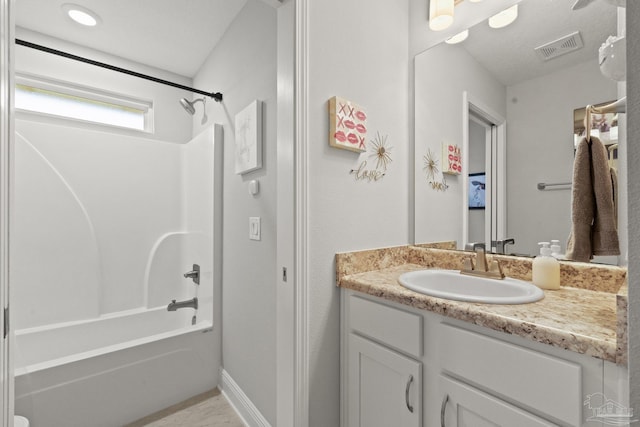 bathroom with vanity and tub / shower combination